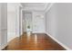 Elegant foyer featuring hardwood floors, white trim, and an open floor plan with natural light at 11484 Lake Stonebridge Ln, Fishers, IN 46037
