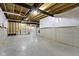 Spacious unfinished basement with concrete walls, exposed wood beams, and utilities at 11595 Platt St, Noblesville, IN 46060