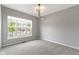 Spacious carpeted bedroom with large windows providing natural light at 11595 Platt St, Noblesville, IN 46060