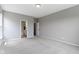 Bright bedroom boasts plush carpeting, soothing gray walls, and entrances to an en-suite bath and walk-in closet at 11595 Platt St, Noblesville, IN 46060