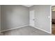 Neutral carpeted bedroom featuring a door leading out of the room at 11595 Platt St, Noblesville, IN 46060