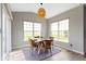 Cozy breakfast nook features a round table, four chairs, and natural light at 11595 Platt St, Noblesville, IN 46060