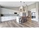Modern kitchen with stainless steel appliances, granite countertops, and a center island with seating at 11595 Platt St, Noblesville, IN 46060