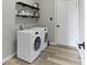 Modern laundry room featuring a front load washer and dryer at 11595 Platt St, Noblesville, IN 46060