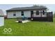 Backyard view of house and wooden deck at 11748 E 10Th St, Indianapolis, IN 46229
