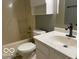 Bathroom featuring a tub and shower, vanity, and commode at 11748 E 10Th St, Indianapolis, IN 46229