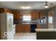 Bright kitchen with wooden cabinets and tile backsplash at 11748 E 10Th St, Indianapolis, IN 46229