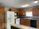 Bright kitchen with wooden cabinets and tile backsplash at 11748 E 10Th St, Indianapolis, IN 46229