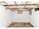 Unfinished basement with exposed ceiling and concrete floor showing utilities ready for customization at 1234 N Dearborn St, Indianapolis, IN 46201