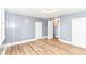 Bedroom featuring wood-look floors, closet, and interior doors at 1234 N Dearborn St, Indianapolis, IN 46201