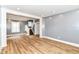 Open-concept living room with wood floors, staircase, and plenty of natural light for a spacious feel at 1234 N Dearborn St, Indianapolis, IN 46201