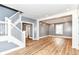 Spacious living room featuring hardwood floors, staircase, and neutral paint, perfect for entertaining at 1234 N Dearborn St, Indianapolis, IN 46201