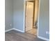 Modern bathroom view from the bedroom featuring a light-colored door that brings convenience and comfort at 12873 Tradd St # 2B, Carmel, IN 46032