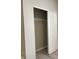 A closet featuring a sliding door, providing ample storage space for clothing and personal items at 12873 Tradd St # 2B, Carmel, IN 46032