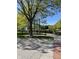 Community park with mature trees, manicured lawns, benches and walkways at 12873 Tradd St # 2B, Carmel, IN 46032