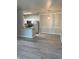 Modern kitchen featuring stainless appliances and an adjacent eating area with modern lighting at 12873 Tradd St # 2B, Carmel, IN 46032