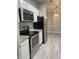 Updated kitchen featuring stainless appliances, granite counters, and open floorplan at 12873 Tradd St # 2B, Carmel, IN 46032