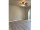 The neutral paint palette and gray flooring create a calming atmosphere in this spacious living area at 12873 Tradd St # 2B, Carmel, IN 46032