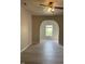 Open living area with an arched doorway and neutral tones, perfect for showcasing your design style at 12873 Tradd St # 2B, Carmel, IN 46032