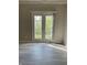 Double glass patio doors leading to an outdoor space at 12873 Tradd St # 2B, Carmel, IN 46032