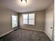 Bright bedroom features natural light, plush carpeting, and neutral paint, creating a calm and inviting atmosphere at 1303 9Th St, Columbus, IN 47201