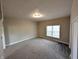 A large bedroom with a large window and neutral colors providing a comfortable and modern space at 1303 9Th St, Columbus, IN 47201