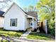 Charming home with front porch and well-maintained lawn and inviting walkway at 1303 9Th St, Columbus, IN 47201