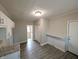 Open concept kitchen leads to hallway with pantry, breakfast bar and door to outside at 1303 9Th St, Columbus, IN 47201