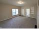 Cozy living room featuring new carpets, neutral colors and large windows for natural light at 1303 9Th St, Columbus, IN 47201