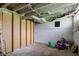 This basement provides unfinished space with white painted walls and ceiling and visible duct work at 1467 W 33Rd St, Indianapolis, IN 46208