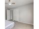 This bedroom boasts a ceiling fan, light wood floors, neutral paint and a spacious closet at 1467 W 33Rd St, Indianapolis, IN 46208