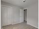 Empty bedroom featuring wood style floors, a double closet, and natural light from a window at 1467 W 33Rd St, Indianapolis, IN 46208