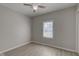Bright bedroom with ceiling fan, natural light from a window, and wood style flooring at 1467 W 33Rd St, Indianapolis, IN 46208