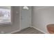 Bright foyer features wood-look floors and a front door with decorative window at 1467 W 33Rd St, Indianapolis, IN 46208