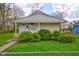 Charming single-story home features a cozy front porch and well-maintained landscaping at 1467 W 33Rd St, Indianapolis, IN 46208
