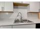 Kitchen sink with stainless steel faucet and white countertops at 1467 W 33Rd St, Indianapolis, IN 46208