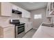 Modern kitchen featuring white cabinets, subway tile backsplash, and ample counter space at 1467 W 33Rd St, Indianapolis, IN 46208