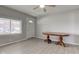 Neutral living room features stylish floors, ceiling fan, and ample natural light at 1467 W 33Rd St, Indianapolis, IN 46208