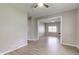 Bright living room featuring ceiling fans and fresh paint throughout the interior at 1467 W 33Rd St, Indianapolis, IN 46208