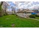 Cozy home with an expansive, lush green yard and a quaint, inviting exterior at 1467 W 33Rd St, Indianapolis, IN 46208