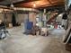 Unfinished basement with exposed brick, ductwork, and concrete flooring, offering potential for customization and additional living space at 1506 Field Dr, Noblesville, IN 46060