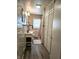 Bathroom featuring a pedestal sink, closet, and shower, providing functionality and storage at 1506 Field Dr, Noblesville, IN 46060
