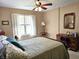 Comfortable bedroom featuring a bed, dresser, and natural light, offering a serene retreat at 1506 Field Dr, Noblesville, IN 46060