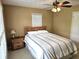 Comfortable bedroom with a ceiling fan and window, furnished with a bed and nightstand at 1506 Field Dr, Noblesville, IN 46060
