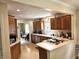 Spacious kitchen with wooden cabinetry, laminate countertops, and modern appliances, creating a functional cooking space at 1506 Field Dr, Noblesville, IN 46060