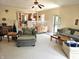 Open living area with comfortable seating, a view into the kitchen, and a welcoming atmosphere for entertaining at 1506 Field Dr, Noblesville, IN 46060