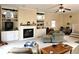 Bright living room with a fireplace, built-in shelves, and plenty of space for furniture, offering a welcoming ambiance at 1506 Field Dr, Noblesville, IN 46060