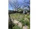 A spacious backyard with patio furniture and a small tool shed at 1525 Home Ave, Anderson, IN 46016