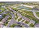 View of a suburban neighborhood with tree-lined streets, sidewalks, and community amenities at 15332 Atkinson Dr, Noblesville, IN 46060