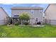 Spacious backyard with patio, gazebo, fire pit, and plenty of green space at 15332 Atkinson Dr, Noblesville, IN 46060